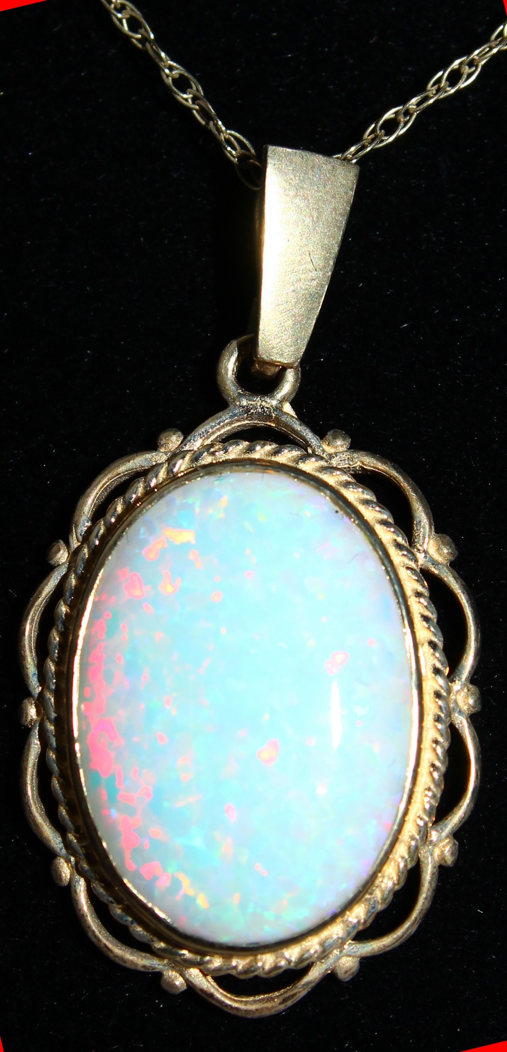A 9CT GOLD OVAL OPAL PENDANT AND CHAIN. - Image 2 of 2