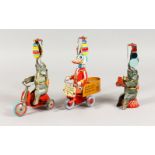 A GROUP OF THREE GERMAN TINPLATE TOYS, modelled as animal circus acts. 7.5ins high.