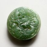 A CARVED SPINACH JADE ROUND BUCKLE.
