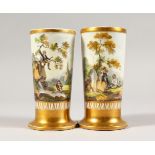 A PAIR OF SPILL VASES, with pink ground and figures in a landscape. 4.5ins high.