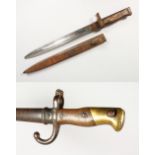 A FRENCH GRAS BAYONET, dated 1877, wood grips, brass pommel, in scabbard, 26ins; and a German Ersatz