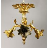 AN ORMOLU THREE BRANCH CEILING LIGHT FITTING, of naturalistic form. 15.5ins high.