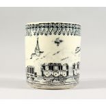 A 19TH CENTURY STAFFORDSHIRE POTTERY MUG, printed with Stephenson's Rocket. 4.25ins high.