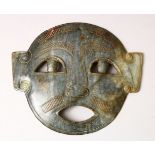 A GOOD CARVED JADE MASK, 14.5cm wide, 12.5cm high.