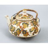 A JAPANESE MEIJI PERIOD IMPERIAL SATSUMA TEAPOT & LID, the pot decorated with scenes of stylized