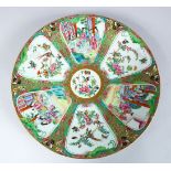 A GOOD 19TH CENTURY CHINESE CANTON FAMILLE ROSE PORCELAIN CHARGER, the charger decorated with panels