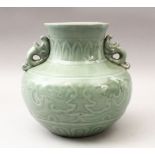 A GOOD CHINESE CELADON TWIN HANDLE PORCELAIN VASE, with moulded chilong decoration to the body, with