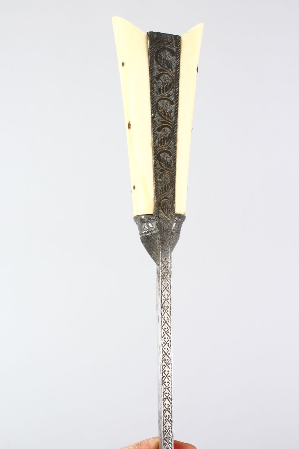 A GOOD 19TH CENTURY ISLAMIC / PERSIAN BONE HANDLED DAGGER, in its metal mounted and leather bound - Image 7 of 10