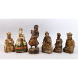 A GOOD MIXED LOT OF EARLY CHINESE CARVED WOODEN FIGURES, each with traces of painted decoration