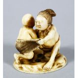 A GOOD JAPANESE MEIJI PERIOD CARVED IVORY NETSUKE OF TWO WRESTLERS, the two wrestlers captured mid
