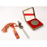 TWO CHINESE ITEMS, A BOXED CHINESE METAL ZODIAC COIN, 4.5cm, & A chinese metal ladies hair pin in