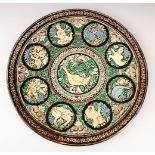 A GOOD 19TH/20TH CENTURY BOMBAY SCHOOL GLAZED POLYCHROME TERACOTTA CHARGER, with animals and