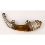 A 19TH CENTURY NORTH AFRICAN POSSIBLY MOROCCAN SILVER OVERLAID POWDER HORN FLASK, 36cm long.