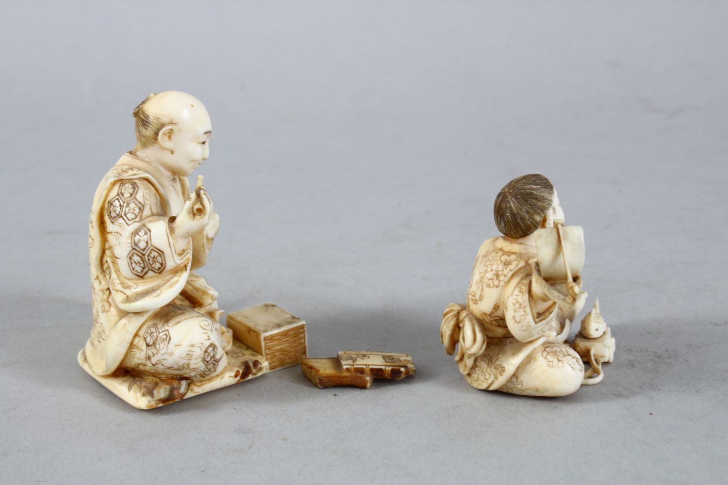 TWO JAPANESE MEIJI PERIOD CARVED IVORY OKIMONO, one carved to depict a seated artisan, the base with - Image 3 of 12