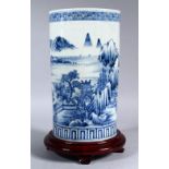 A GOOD EDO 18TH CENTURY JAPANESE BLUE & WHITE PORCELAIN CYLINDRICAL VASE & STAND, the body of the
