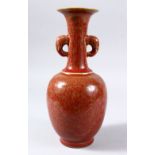 A 19TH / 20TH CENTURY CHINESE OX BLOOD GLAZE TWIN HANDLE VASE, with a flambe style ox blood red