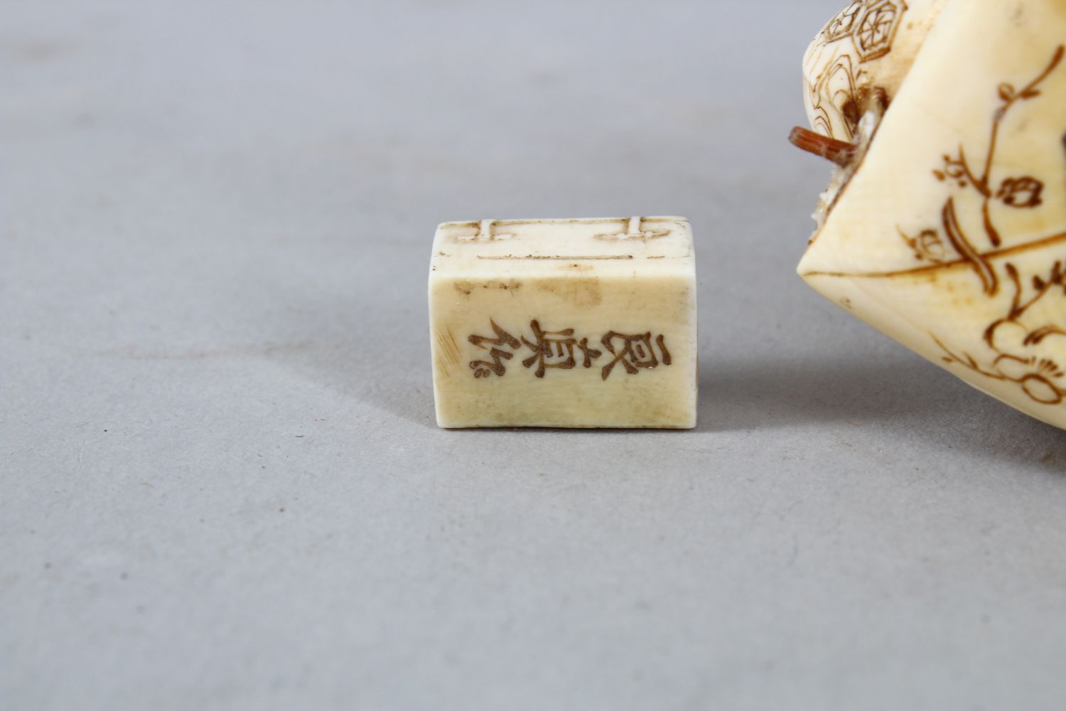 TWO JAPANESE MEIJI PERIOD CARVED IVORY OKIMONO, one carved to depict a seated artisan, the base with - Image 12 of 12