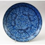 A GOOD 19TH /20TH CENTURY JAPANESE MOULDED BLUE GROUND PORCELAIN DISH, with moulded floral