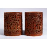 A GOOD PAIR OF 19TH CENTURY CHINESE CANTON CARVED WOOD BRUSH POTS / WASHERS, the pots carved with