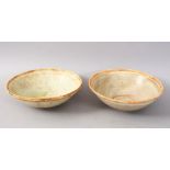 A GOOD PAIR OF EARLY CHINESE POTTERY BOWLS, 15cm diameter.