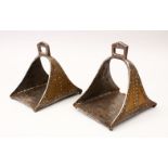 A 19TH CENTURY ISLAMIC PAIR OF INLAID STEEL STIRRUPS, inlaid with mixed metal, 17cm long, 16cm