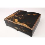 A JAPANESE MEIJI PERIOD LACQUER GAMES BOX, opening to reveal four decorated lidded storage boxes