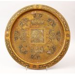 A 19TH CENTURY ISLAMIC SILVER INLAID BRASS CALLIGRAPHIC DISH, with circular bands of inlaid