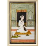 A GOOD 19TH CENTURY INDO PERSIAN PAINTED MINIATURE, depicting a seated figure playing an instrument,