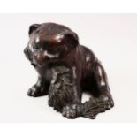 A FINE QUALITY JAPANESE MEIJI PERIOD BRONZE AKITA PUPPY OKIMONO, the pup moddled in a seated