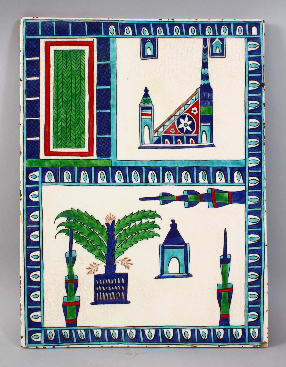 A GOOD 19TH CENTURY ISLAMIC TILE PANEL, the panel depicting stylized temples and foliage, 36.5cm