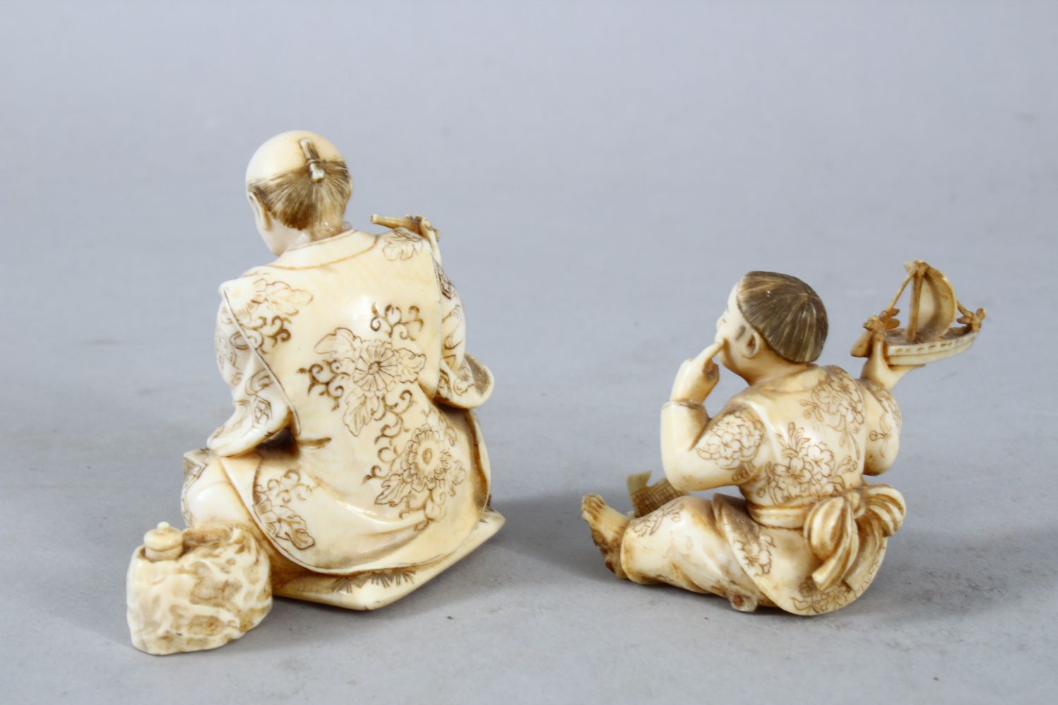 TWO JAPANESE MEIJI PERIOD CARVED IVORY OKIMONO, one carved to depict a seated artisan, the base with - Image 8 of 12