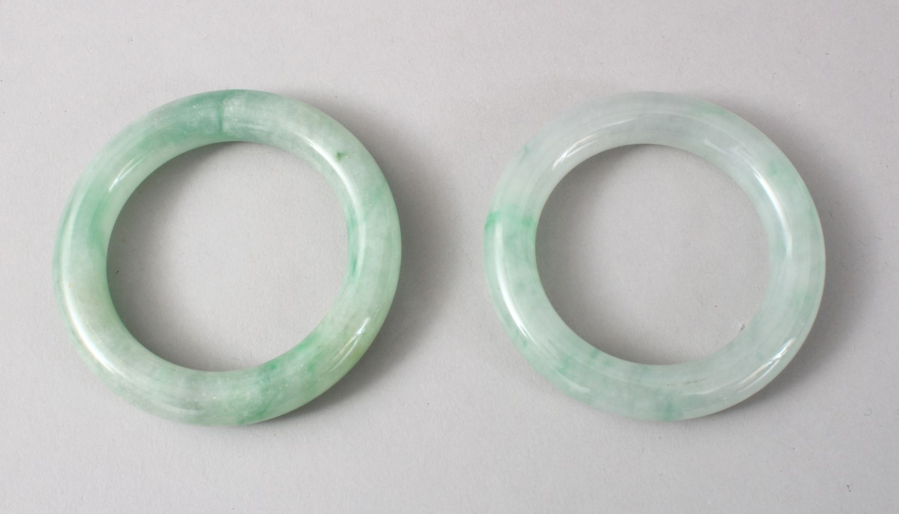 TWO GOOD CHINESE CARVED JADE BANGLES, 8cm diameter with an internal measurement of 5cm. - Image 2 of 5