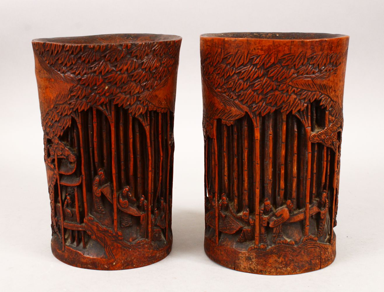 A GOOD PAIR OF 19TH CENTURY CHINESE BAMBOO BRUSH POTS, each decorated in relief to depict working