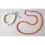A CHINESE MOTHER OF PEARL BEAD BRACELET, with a coral bead necklace.