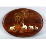 AN INDIAN CARVED WOOD AND INLAID PAN EL OF ELEPHANTS, the elephant inlaid with carved bone