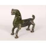 A 12TH/13TH CENTURY ISLAMIC SELJUK BRONZE LION, with openwork decoration, 11cm long, 10.5cm high.