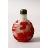 A GOOD 19TH / 20TH CENTURY CHINESE RED OVERLAY FROST GLASS SNUFF BOTTLE, depicting scenes of animals
