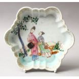 A GOOD 18TH CENTURY CHINESE FAMILLE ROSE PORCELAIN MOULDED DISH, the dish decorated with scenes of a