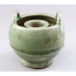 A GOOD CHINESE SONG STYLE CELADON PORCELAIN CANDLESTICK HOLDER, with twin moulded handles and