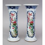 A GOOD PAIR OF EARLY 20TH CENTURY CHINESE FAMILLE ROSE PORCELAIN SLEEVE VASES, each vase with an