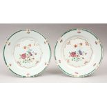 TWO 18TH CENTURY CHINESE FAMILLE ROSE PLATES, 23cm diameter.