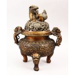 A GOOD 19TH / 20TH CENTURY CHINESE BRONZE LIDDED CENSER, the body with twin moulded handles and