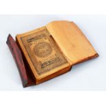 A GOOD 19TH CENTURY ISLAMIC LEATHER BOUND BOOK OF QURAN ( AH1302 MUHARRAM 1299), 25cm x 17cm.