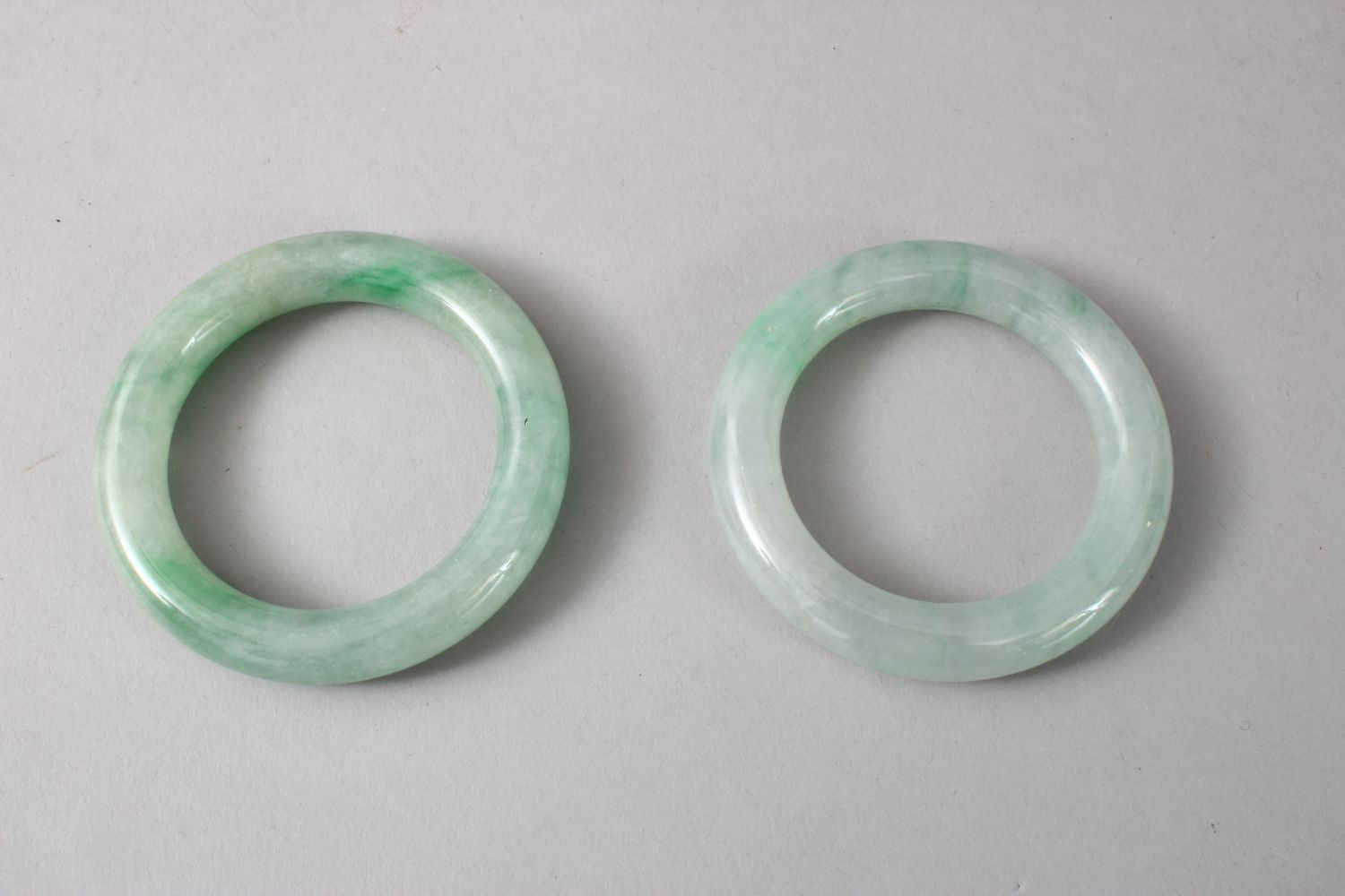 TWO GOOD CHINESE CARVED JADE BANGLES, 8cm diameter with an internal measurement of 5cm. - Image 3 of 5