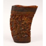 A GOOD CHINESE 19TH / 20TH CENTURY CARVED BUFFALO HORN LIBATION CUP, carved with scenes of