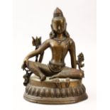 A GOOD 19TH CENTURY INDIAN BRONZE BUDDHA, in a seated position, 20cm high, 15cm wide.