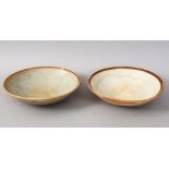 A GOOD PAIR OF EARLY CHINESE POTTERY BOWLS, 14.5cm diameter.