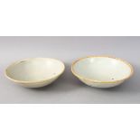 A GOOD PAIR OF EARLY CHINESE POTTERY BOWLS, 15cm diameter.