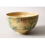 A JAPANESE MEIJI PERIOD SATSUMA TEA BOWL, the body decorated with bamboo and pine trees