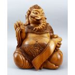 A GOOD QUALITY CARVED WOODEN INDIAN FIGURE OF GANESH, seated in mediation position, 35cm high x 26cm